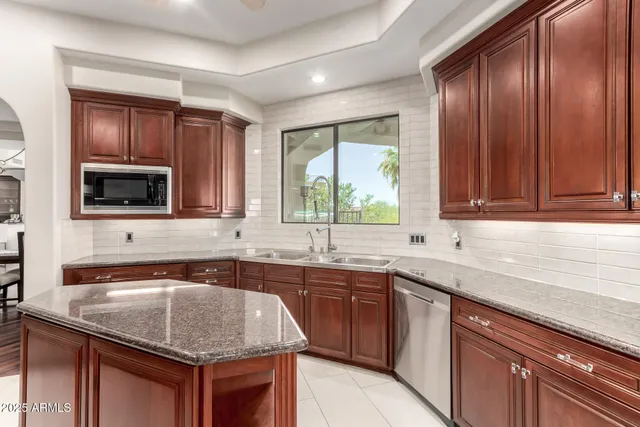 a bedroom with a bed and a chair