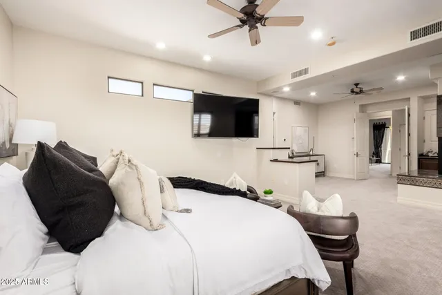 a bathroom with a tub a double vanity sink and a bathtub