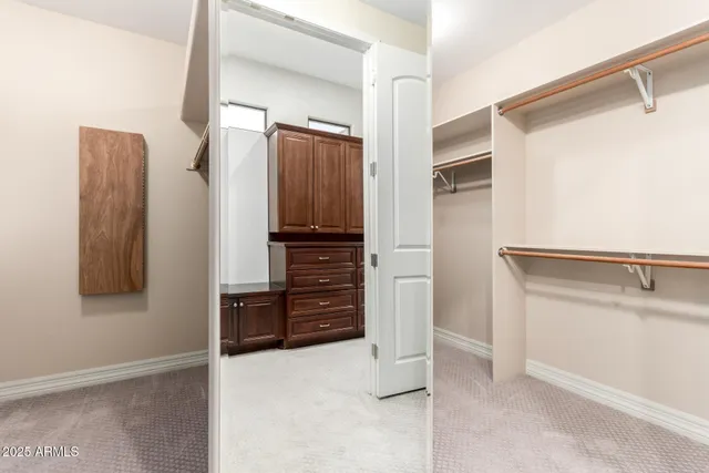 a living room with furniture a flat screen tv and a large window