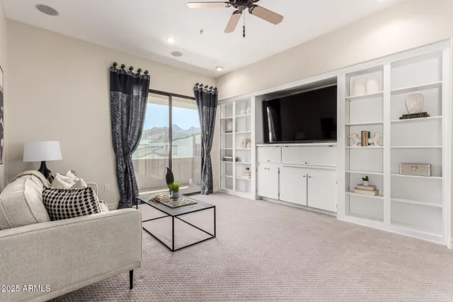 a view of a house with swimming pool and sitting area