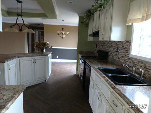 139 Roy Bryant Road Cochran, GA 31014 - Photo 11 of 14 a kitchen that has a sink and a stove