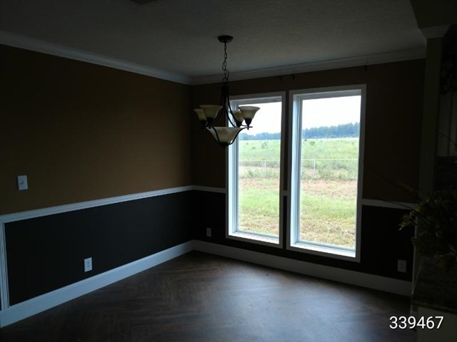 139 Roy Bryant Road Cochran, GA 31014 - Photo 13 of 14 a view of room with window and hardwood floor