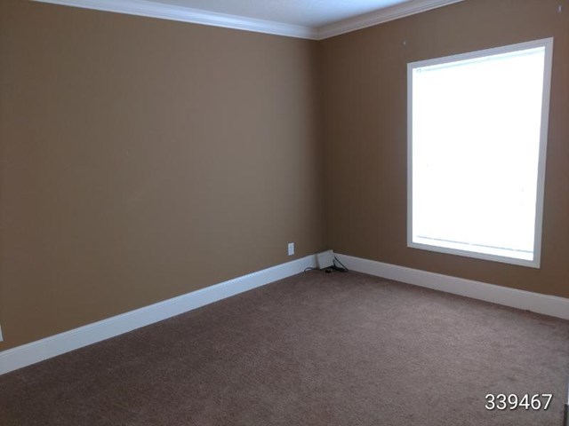 139 Roy Bryant Road Cochran, GA 31014 - Photo 3 of 14 a view of an empty room with a window