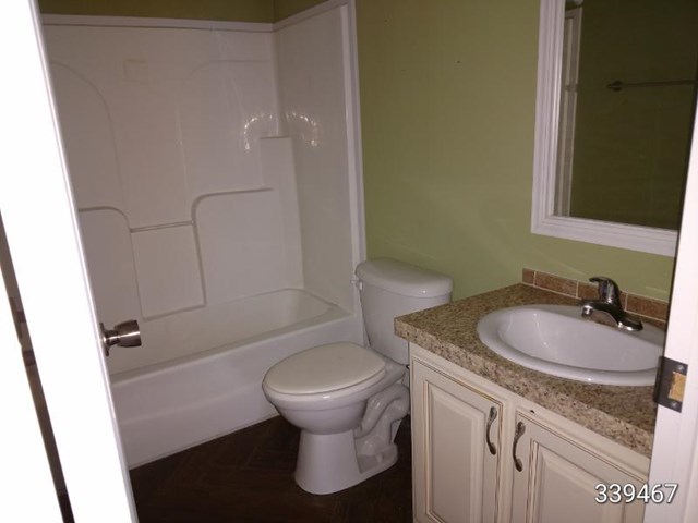 139 Roy Bryant Road Cochran, GA 31014 - Photo 4 of 14 a bathroom with a sink toilet and shower