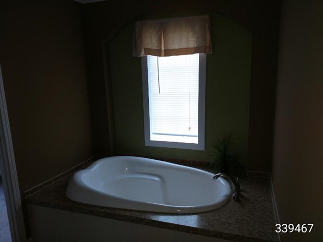 139 Roy Bryant Road Cochran, GA 31014 - Photo 7 of 14 a bathroom with a sink and a window