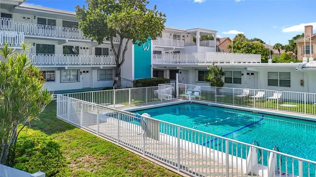 a front view of a house with swimming pool