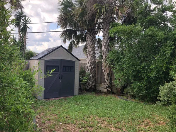 a house with a tree in front of it