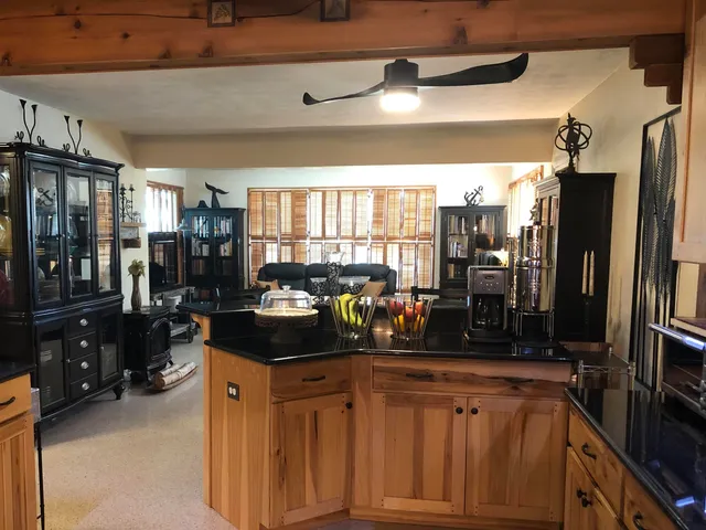 a kitchen with stainless steel appliances a sink and cabinets