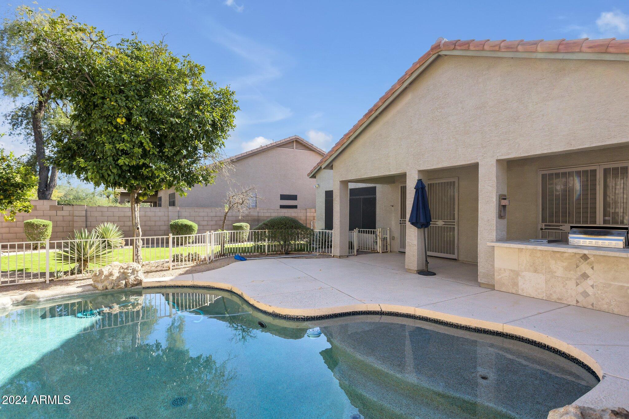 4522 East Jaeger Road Phoenix, AZ 85050 - Photo 25 of 28 Covered Patio and Large Pool