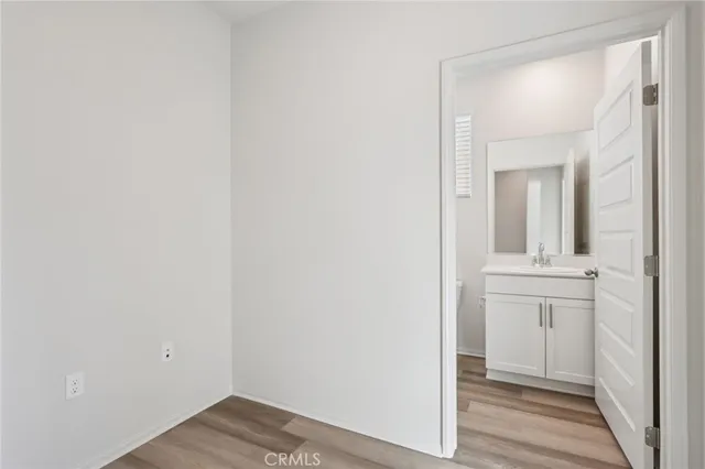 a view of a bathroom from a hallway