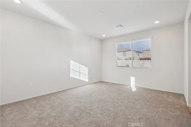 an empty room with a empty space and window