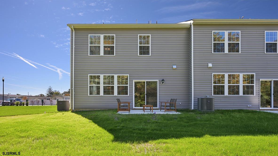 500 Scotty Boulevard, Unit 1201 Rio Grande, NJ 08242 - Photo 42 of 43 a front view of a house with a yard and green space