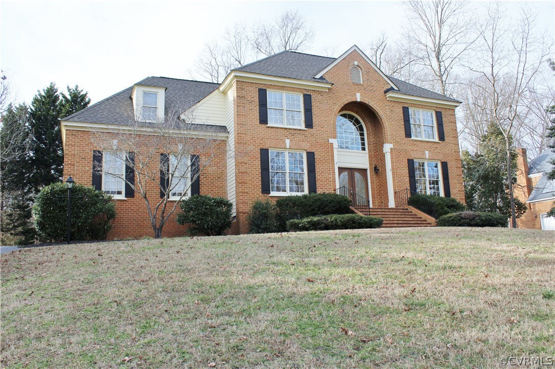 a front view of a house with a yard
