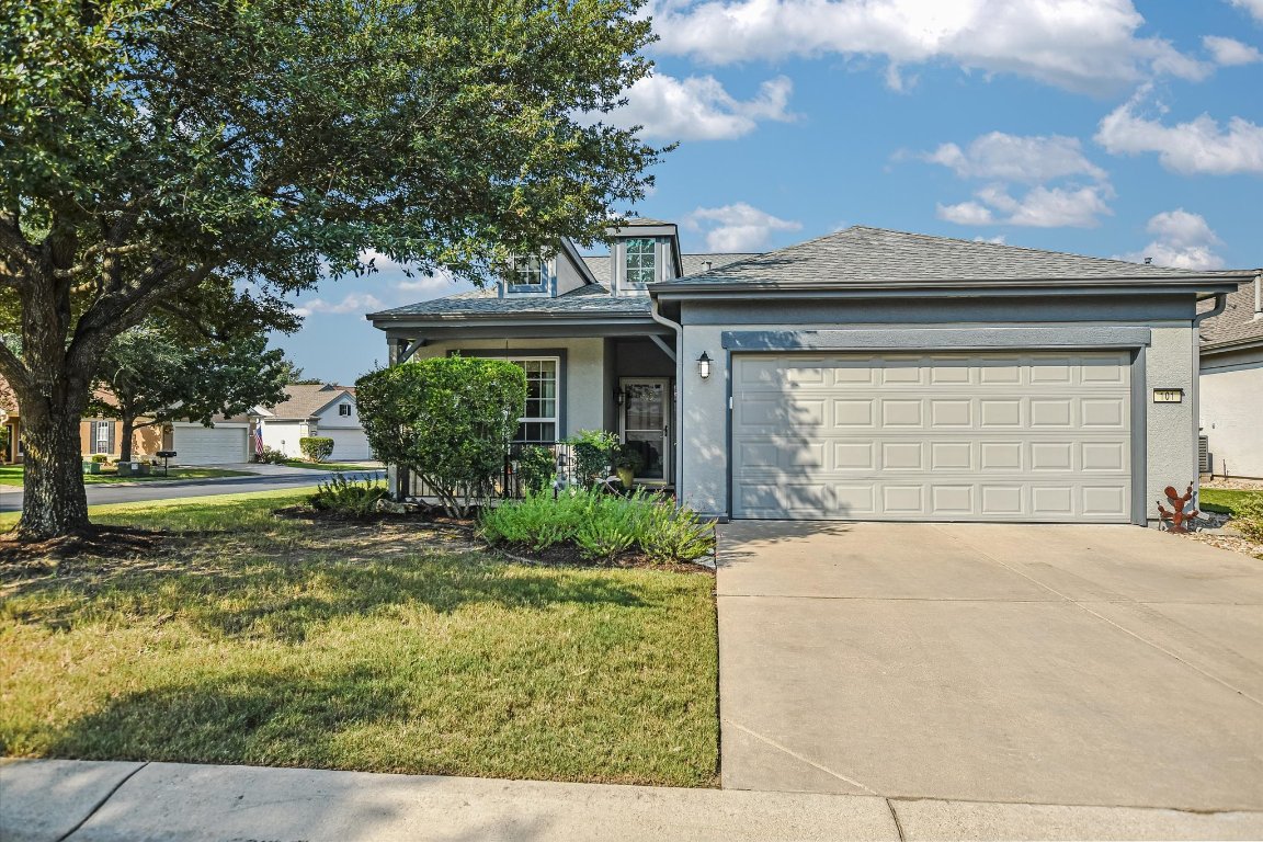 Outstanding curb appeal on this Sun City home! Set on a desirable corner lot, the property showcases a shaded yard with mature oak trees, a covered front porch, and a spacious two-car garage. A perfect balance of comfort, style, and low-maintenance living.