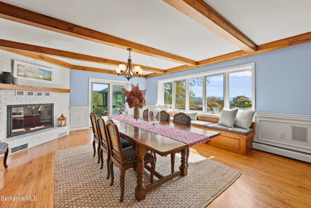 a bedroom with a bed a lamp and a large mirror