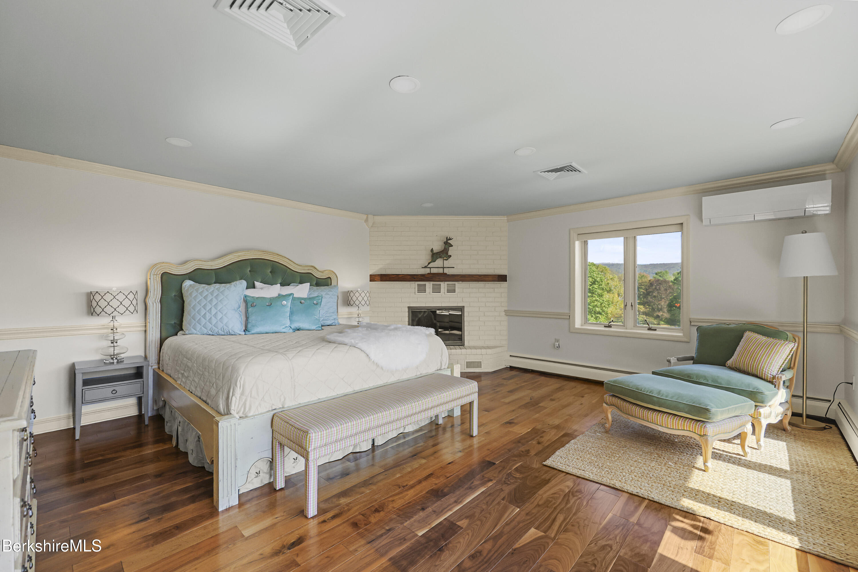 60 Old Cheshire Road Lanesborough, MA 01237 - Photo 39 of 81 a bedroom with a bed a table and chair