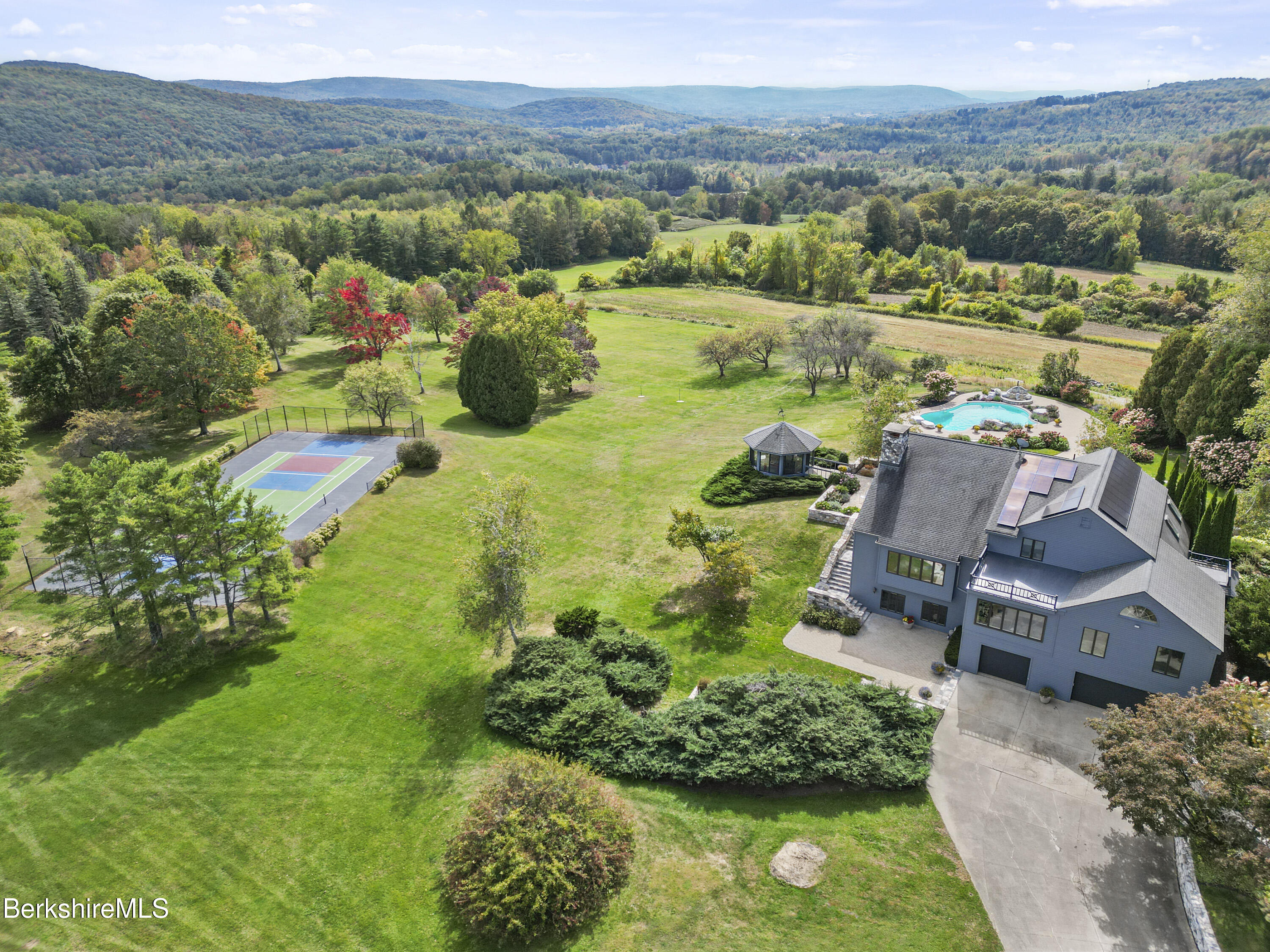 60 Old Cheshire Road Lanesborough, MA 01237 - Photo 74 of 81 an aerial view of a house with a garden and lake view