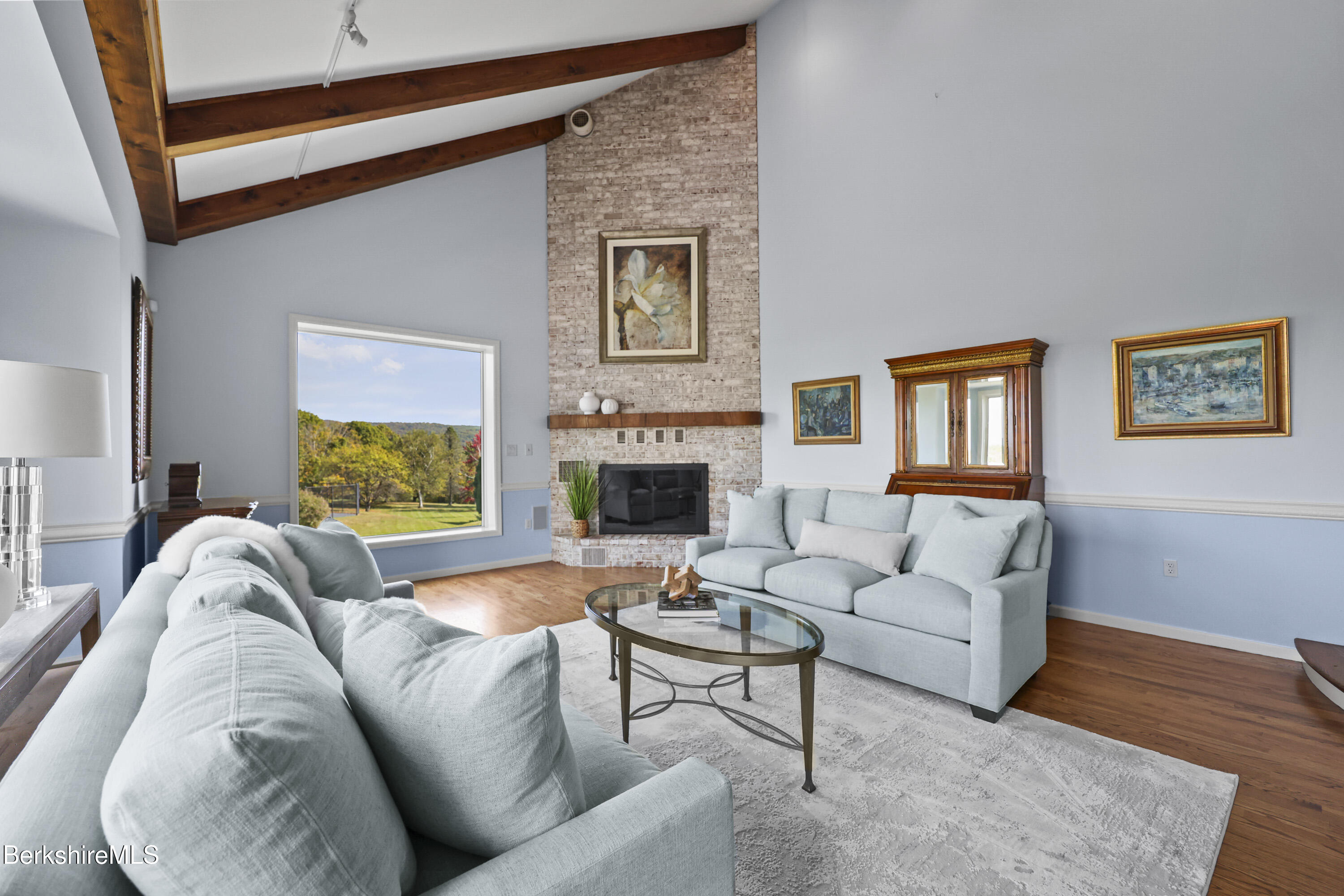 60 Old Cheshire Road Lanesborough, MA 01237 - Photo 10 of 81 a living room with furniture and a fireplace