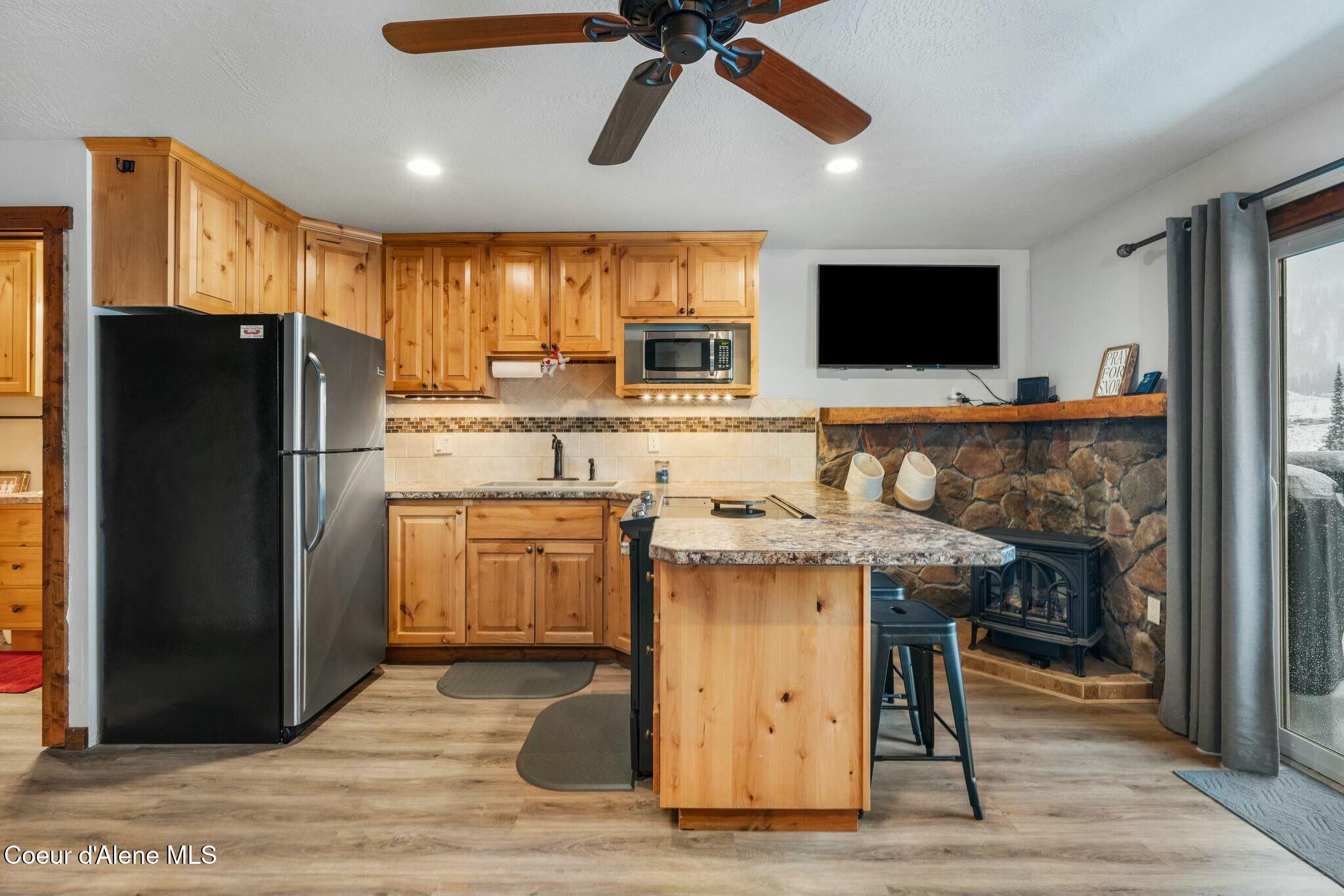 8754 Schweitzer Mountain Road, Unit 20 Sandpoint, ID 83864 - Photo 13 of 32 Cozy Free-Standing Gas Stove