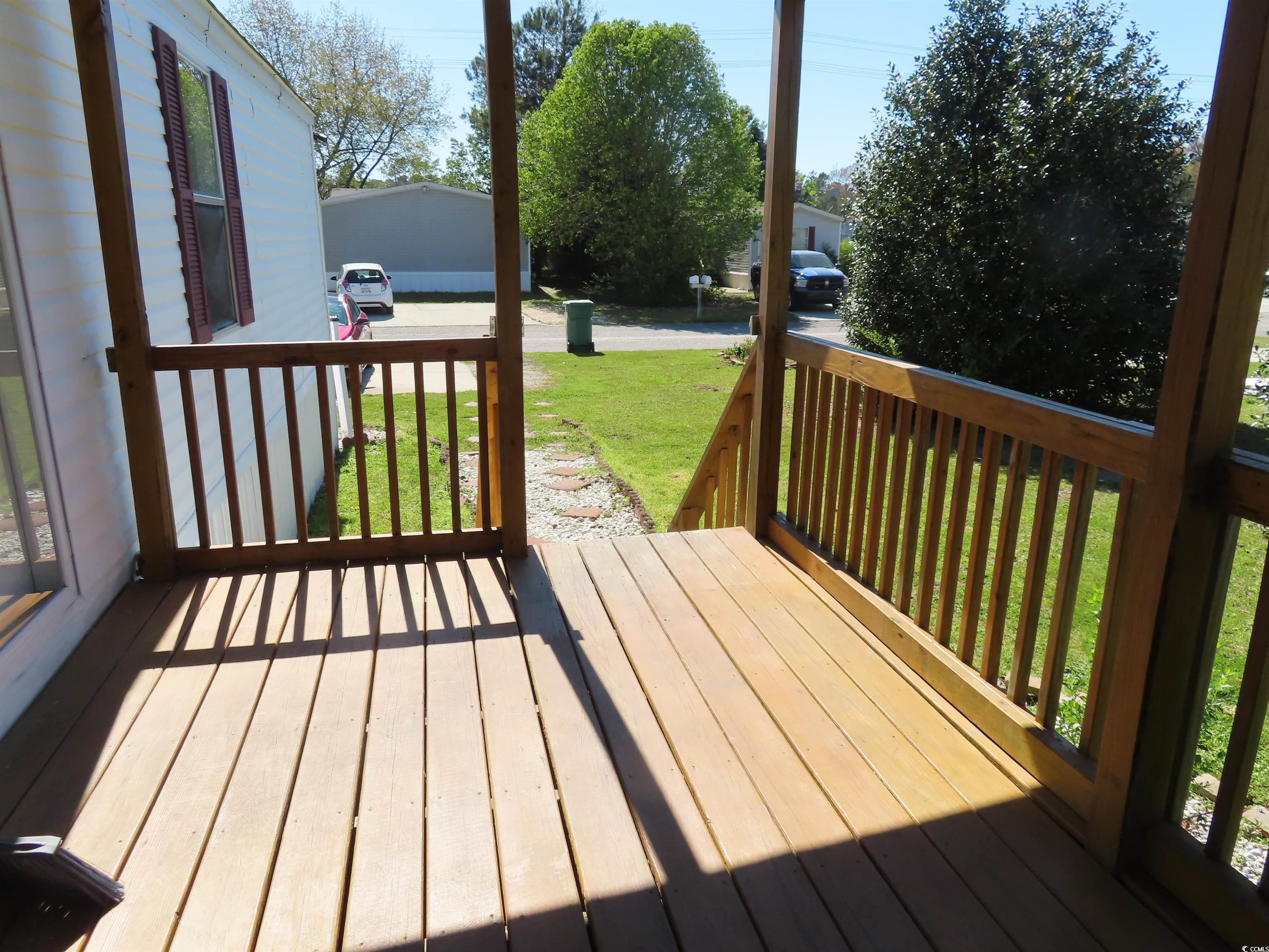 9323 Shoveler Drive Murrells Inlet, SC 29576 - Photo 3 of 23 Wooden deck with a lawn