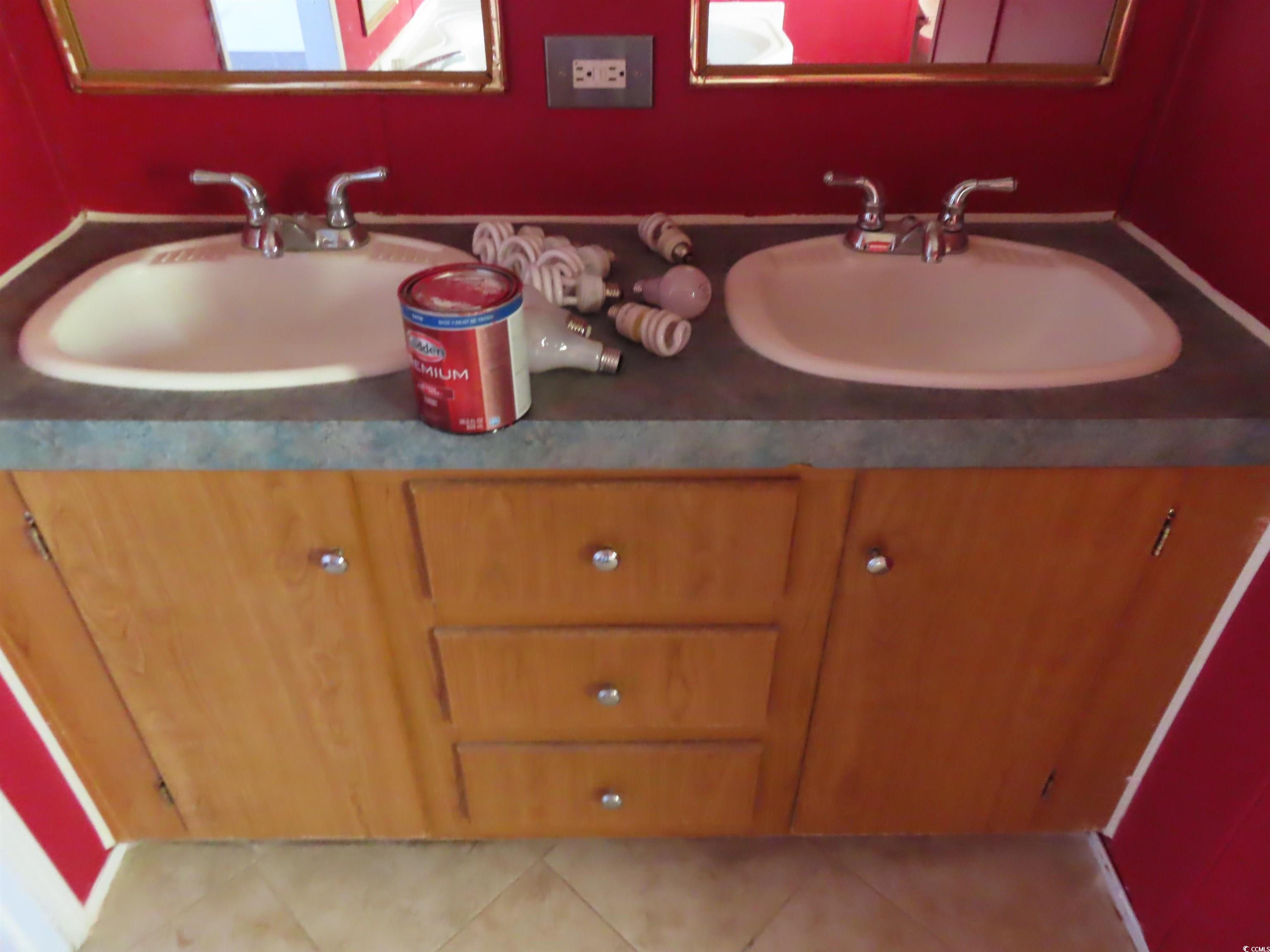 9323 Shoveler Drive Murrells Inlet, SC 29576 - Photo 8 of 23 Bathroom with tile patterned flooring and vanity