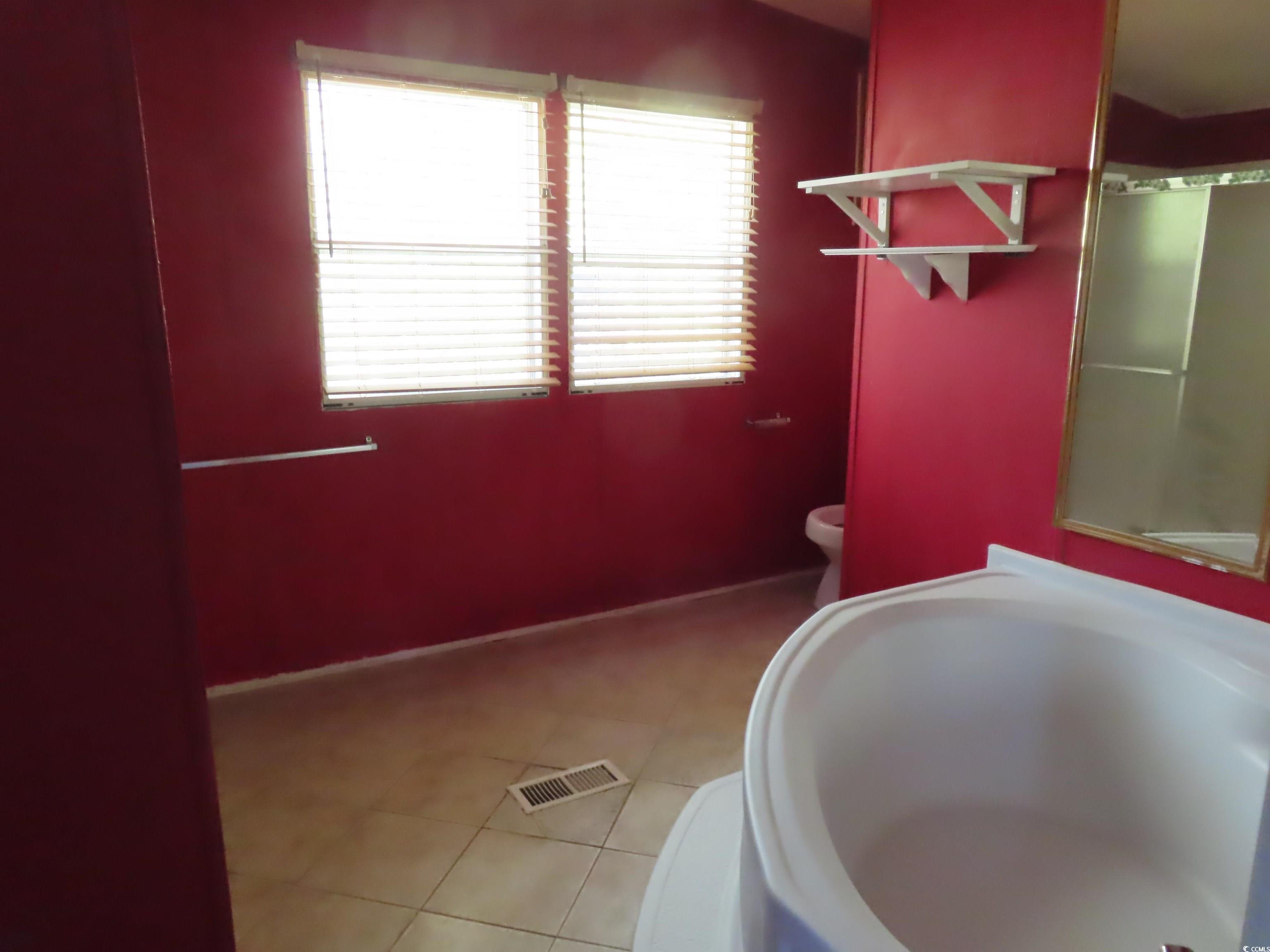 9323 Shoveler Drive Murrells Inlet, SC 29576 - Photo 9 of 23 Bathroom with tile patterned flooring, visible vents, and toilet