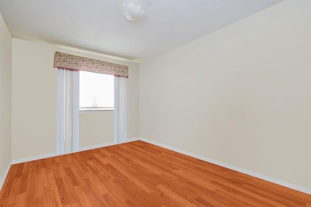 2329 West Street Brooklyn, NY 11223 - Photo 15 of 26 a view of empty room with wooden floor