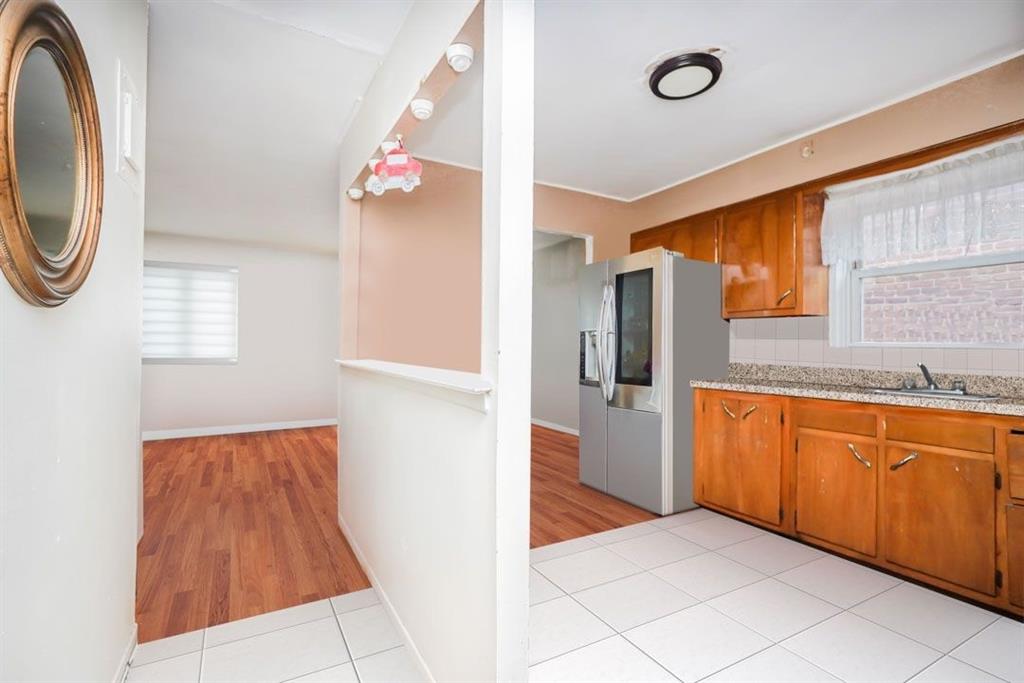 2329 West Street Brooklyn, NY 11223 - Photo 21 of 26 a hallway with washer and dryer