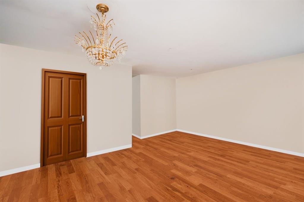 2329 West Street Brooklyn, NY 11223 - Photo 22 of 26 a view of empty room with wooden floor