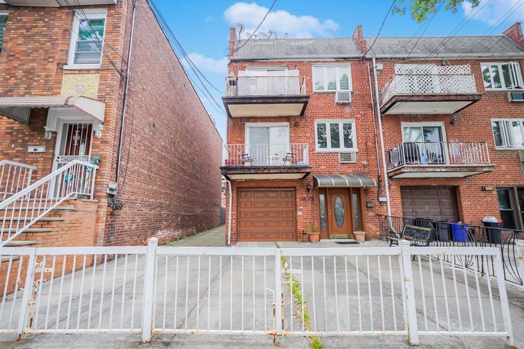 2329 West Street Brooklyn, NY 11223 - Photo 3 of 26 an outdoor view of a house with a iron gate