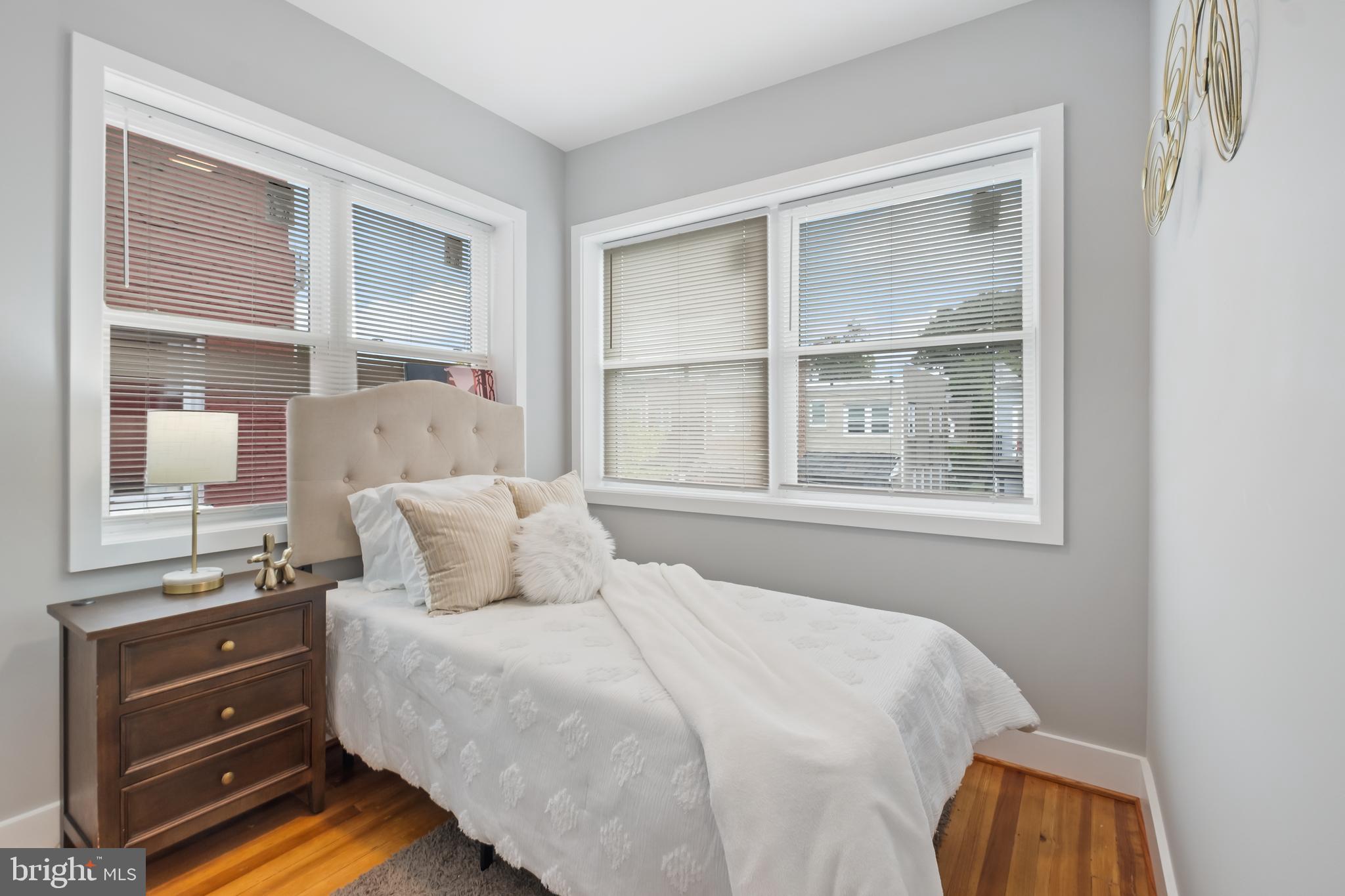 607 Tuckerman Street Northwest Washington, DC 20011 - Photo 16 of 25 a bedroom with a bed and a window