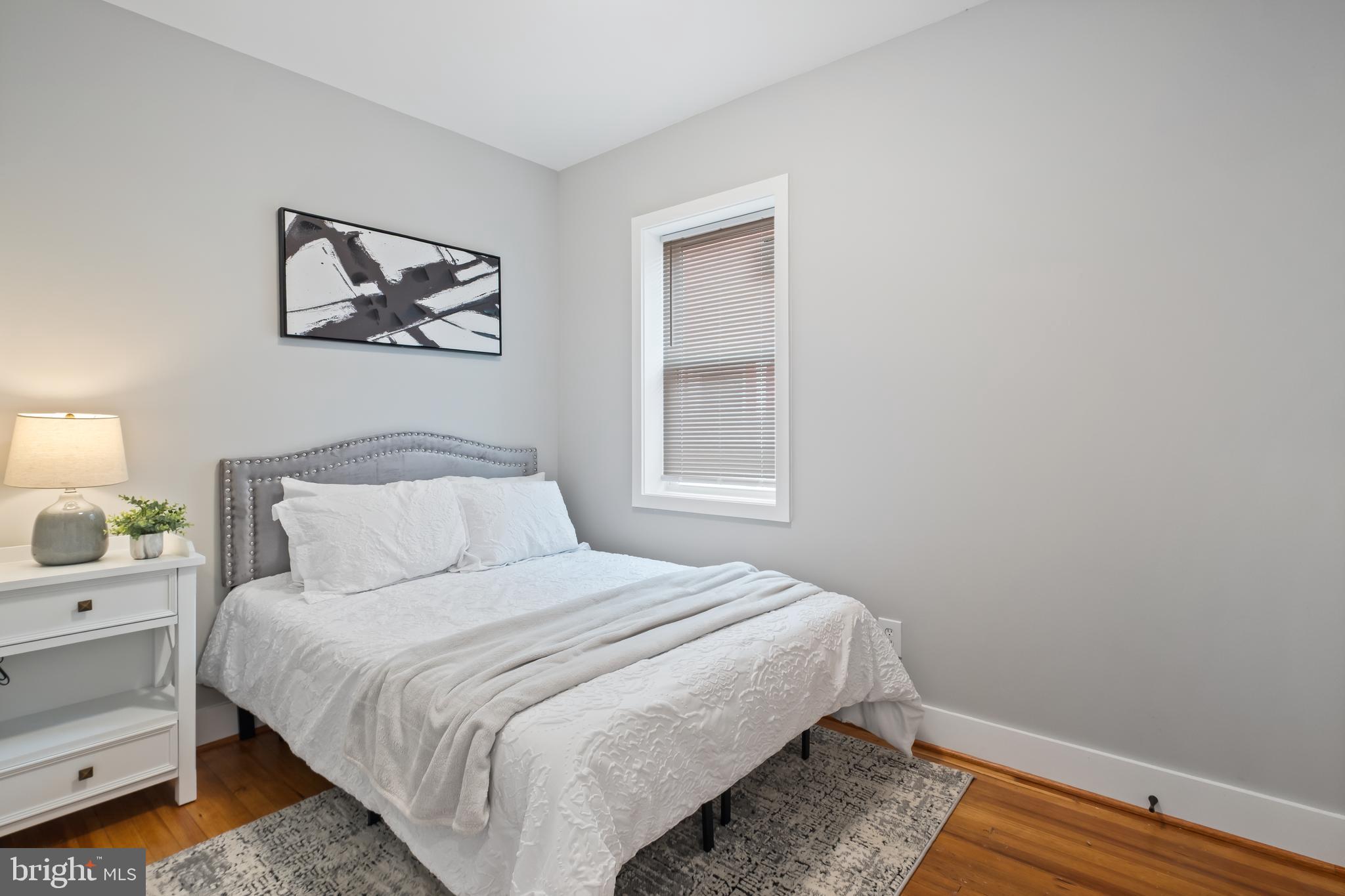 607 Tuckerman Street Northwest Washington, DC 20011 - Photo 18 of 25 a bedroom with a bed and a window