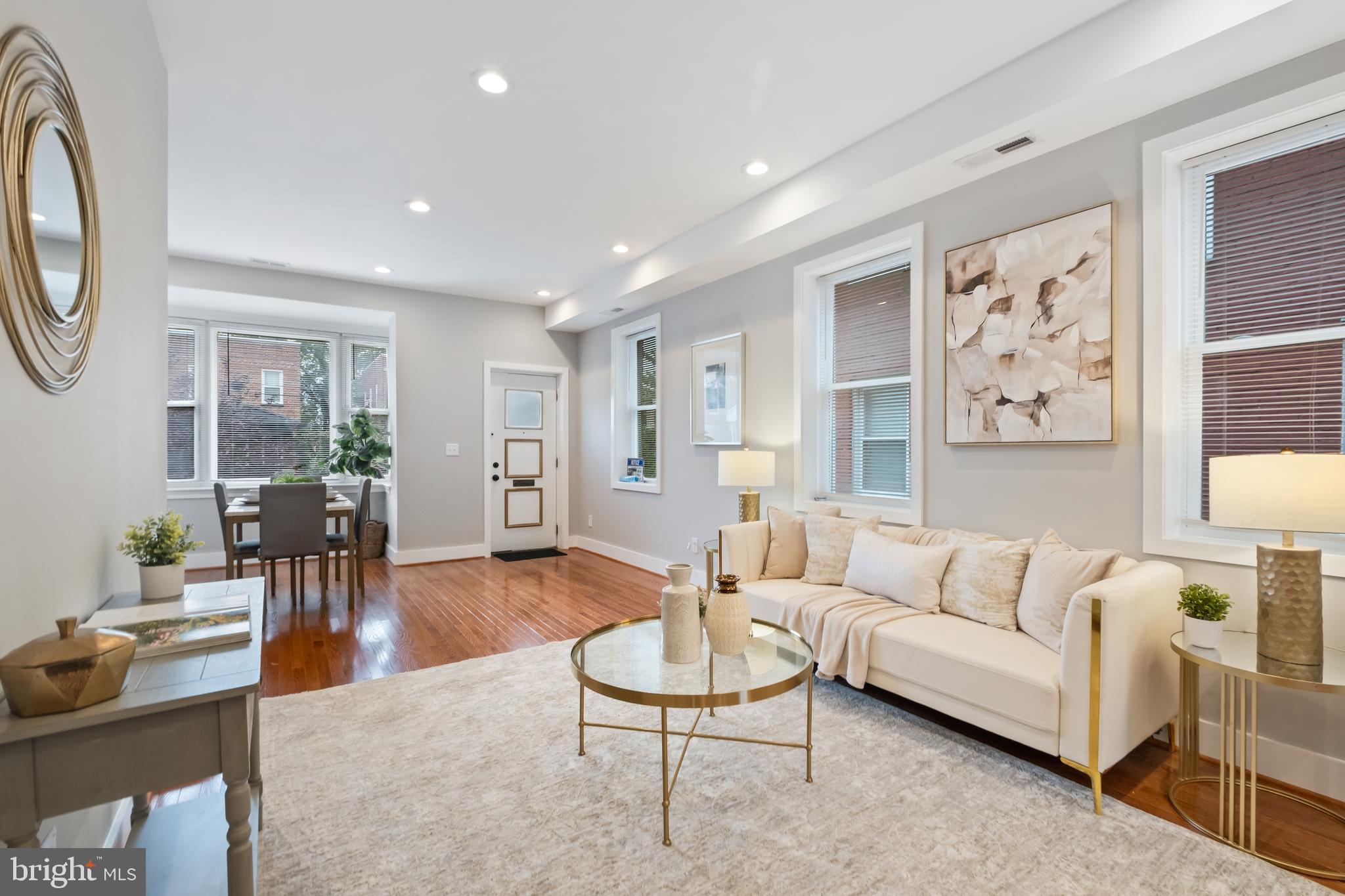 607 Tuckerman Street Northwest Washington, DC 20011 - Photo 3 of 25 a living room with furniture and a large window
