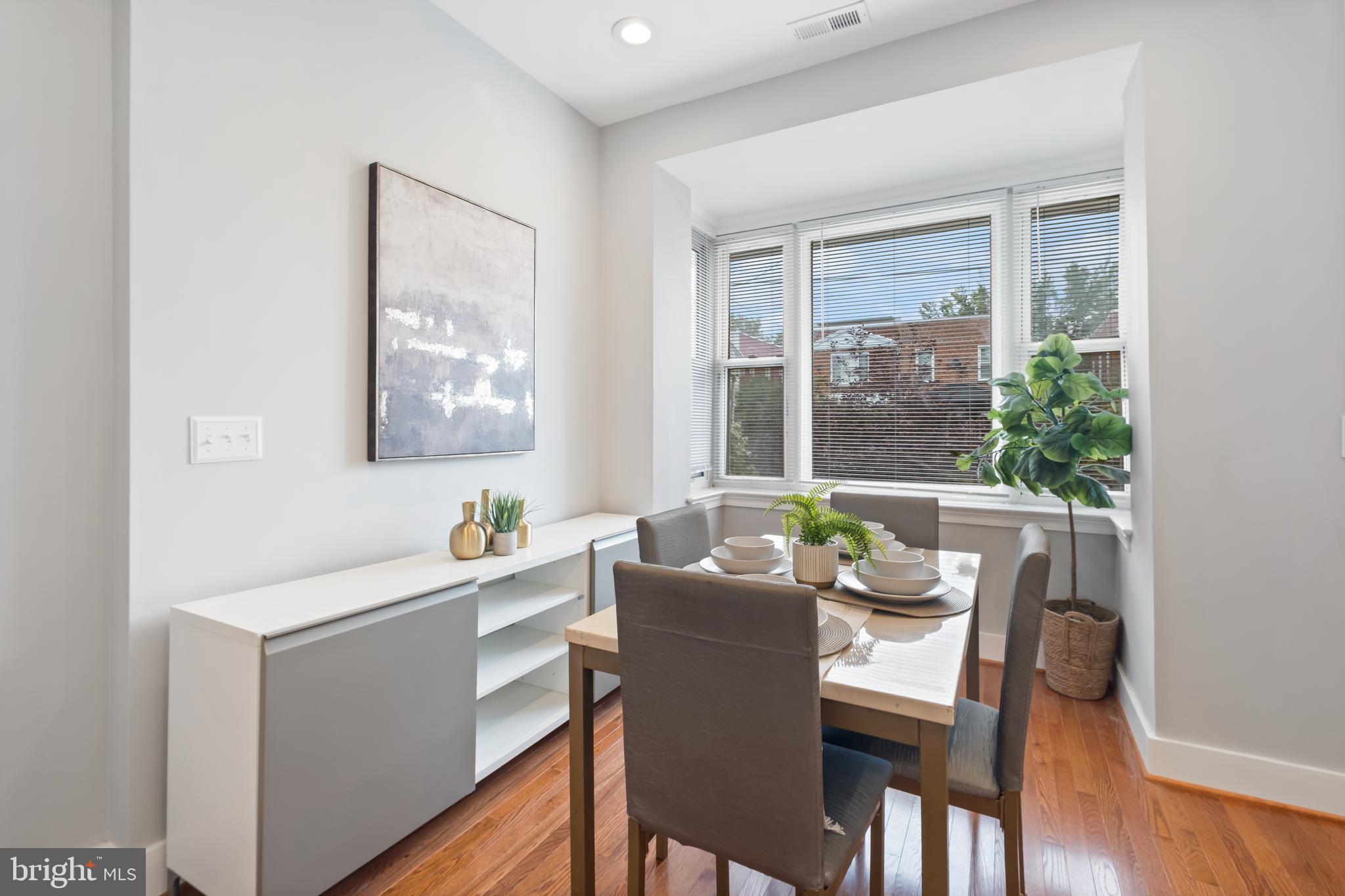 607 Tuckerman Street Northwest Washington, DC 20011 - Photo 5 of 25 a dining room with furniture and window