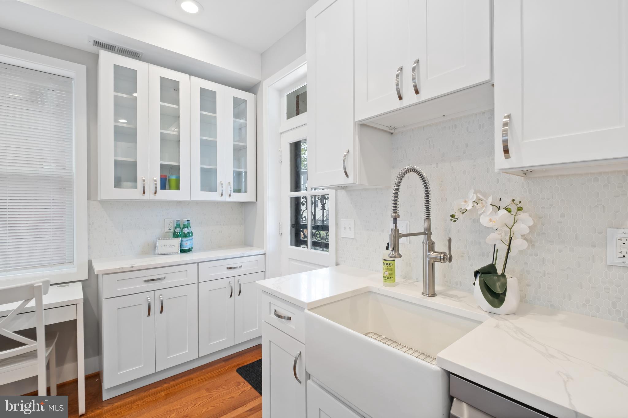 607 Tuckerman Street Northwest Washington, DC 20011 - Photo 8 of 25 a kitchen with a sink and cabinets