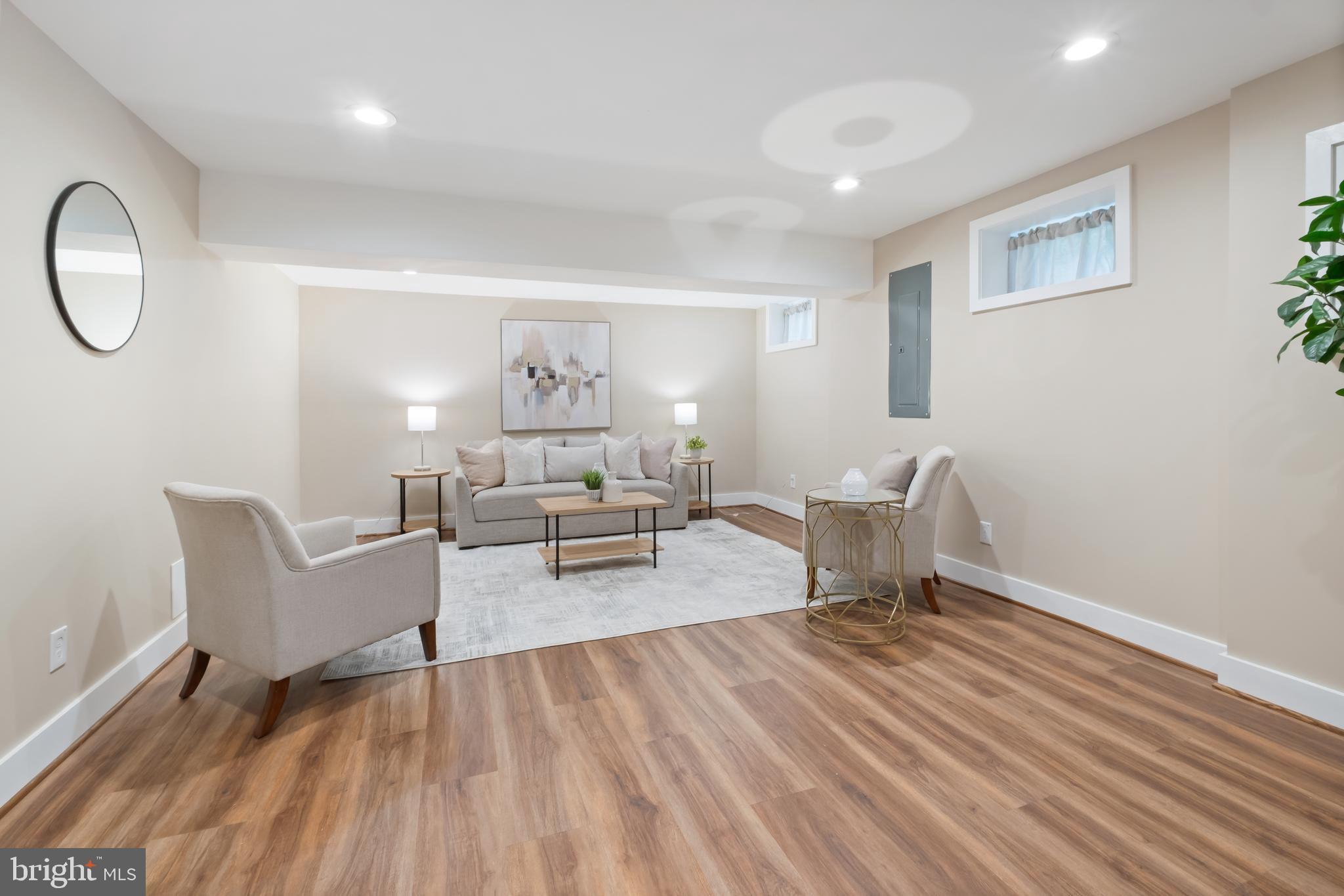 607 Tuckerman Street Northwest Washington, DC 20011 - Photo 10 of 25 a living room with furniture a mirror and a window