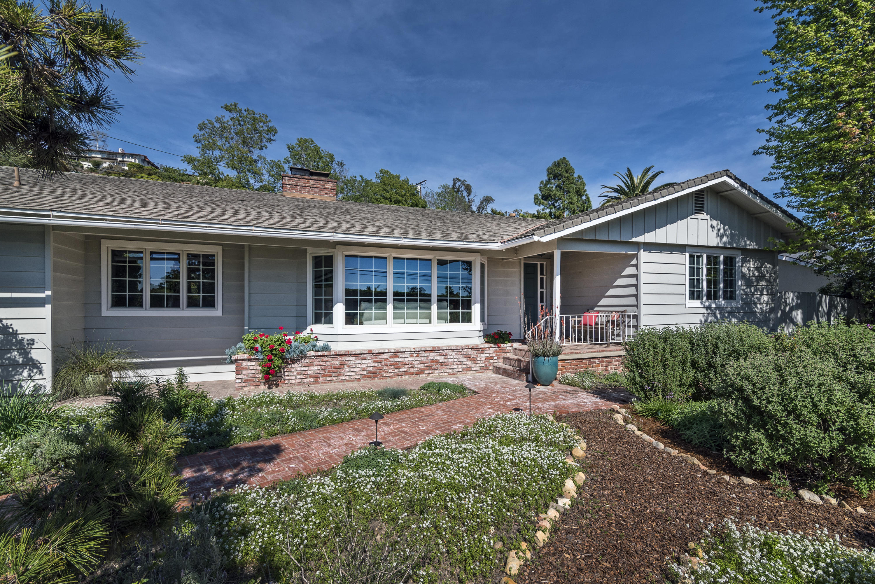 207 Alston Road Santa Barbara, CA 93108 - Photo 1 of 14 a front view of a house with garden
