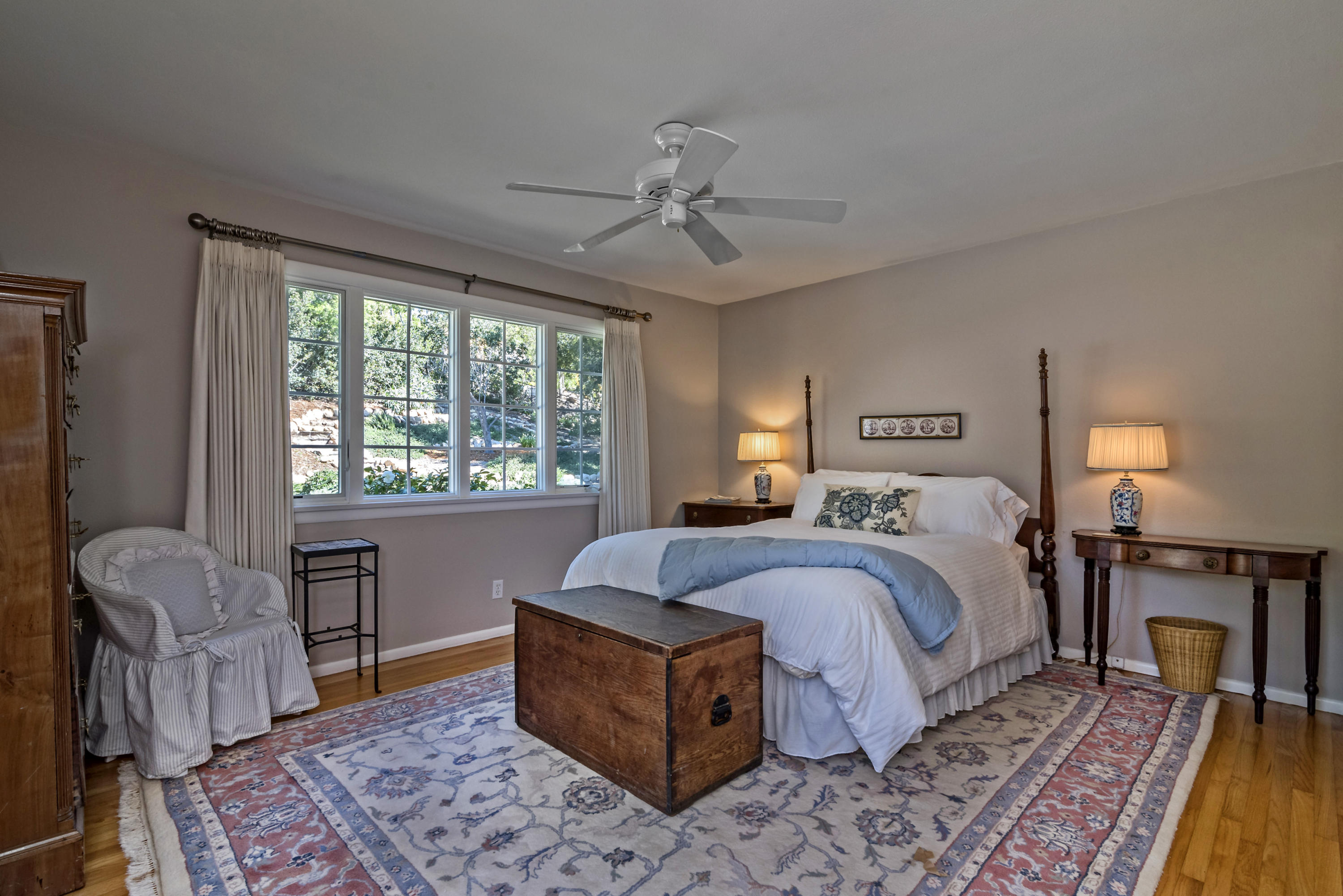 207 Alston Road Santa Barbara, CA 93108 - Photo 11 of 14 a bed room with a bed and a chandelier