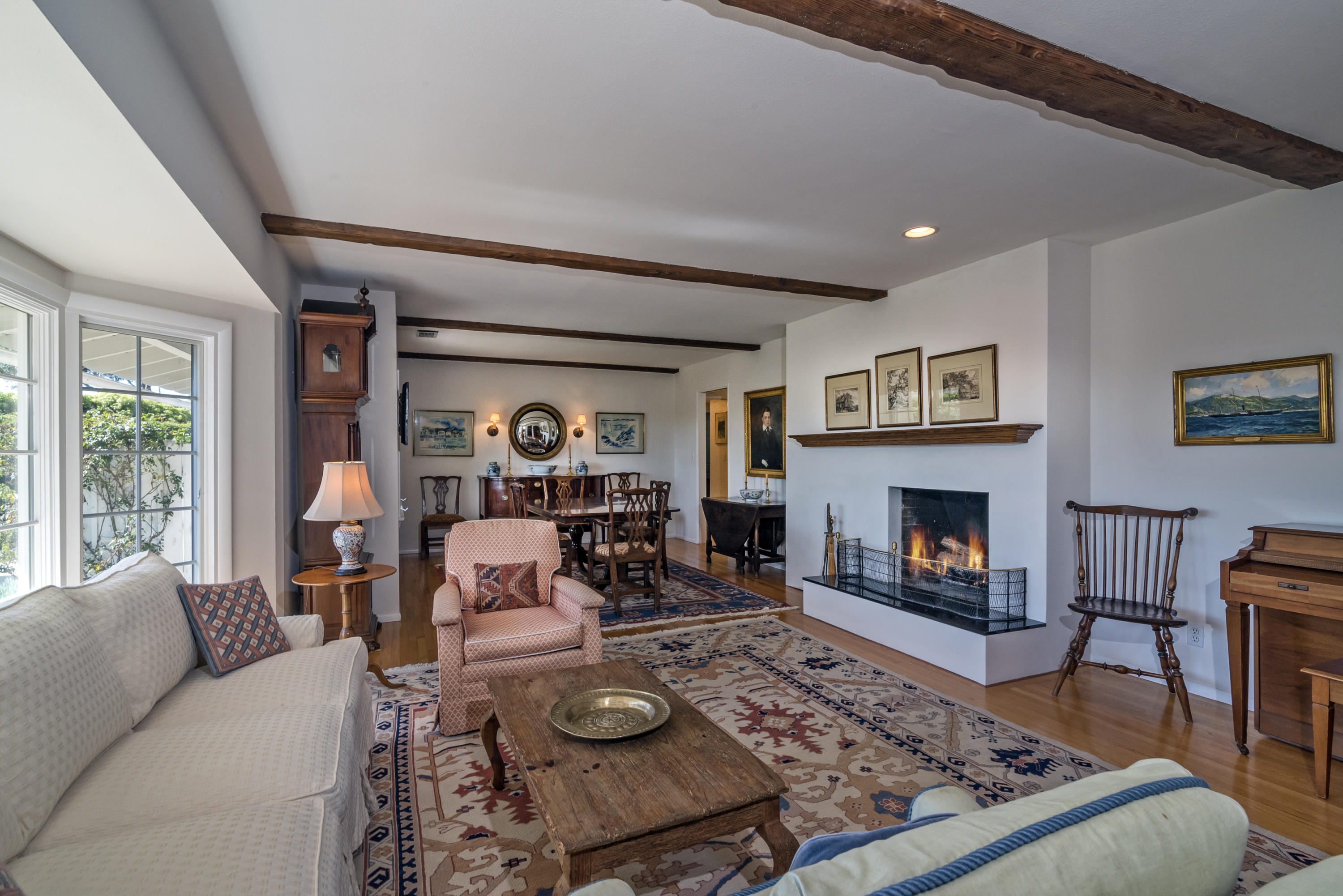 207 Alston Road Santa Barbara, CA 93108 - Photo 2 of 14 a living room with furniture and a fireplace