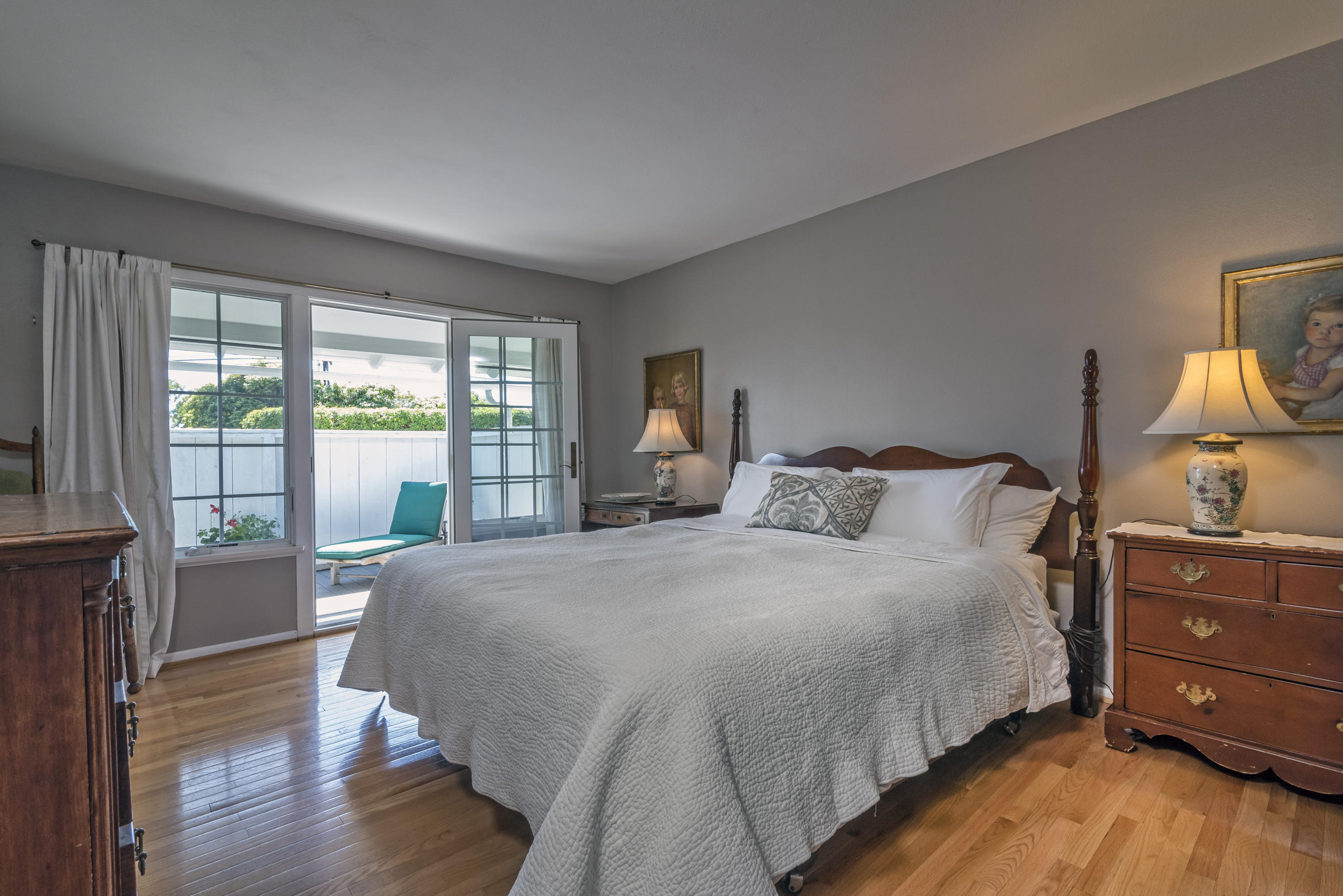 207 Alston Road Santa Barbara, CA 93108 - Photo 7 of 14 a bedroom with a bed and large windows