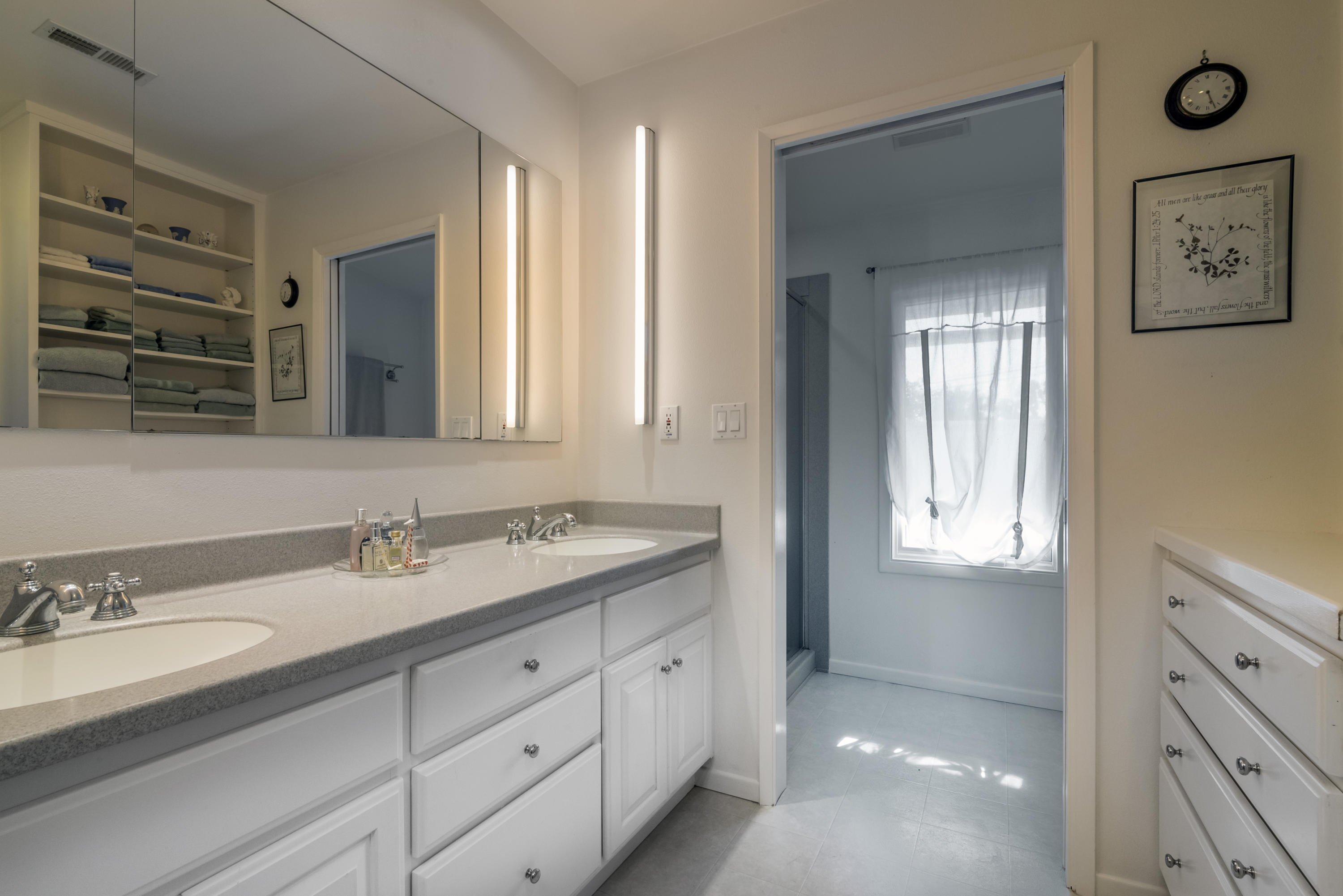 207 Alston Road Santa Barbara, CA 93108 - Photo 9 of 14 a bathroom with double vanity sink a mirror and a bathtub