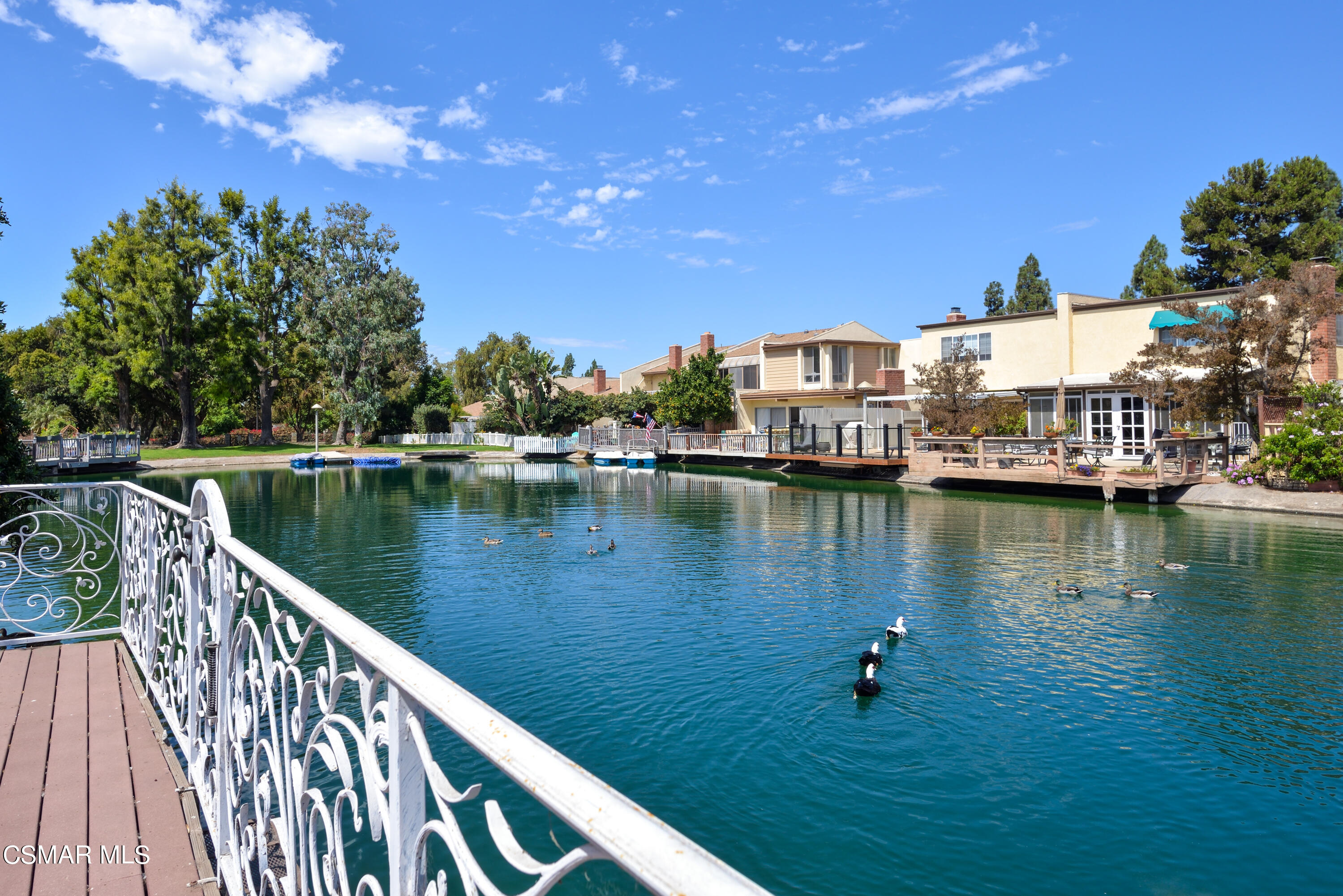 1667 Edgewater Lane Camarillo, CA 93010 - Photo 1 of 32 a view of a lake with a large trees