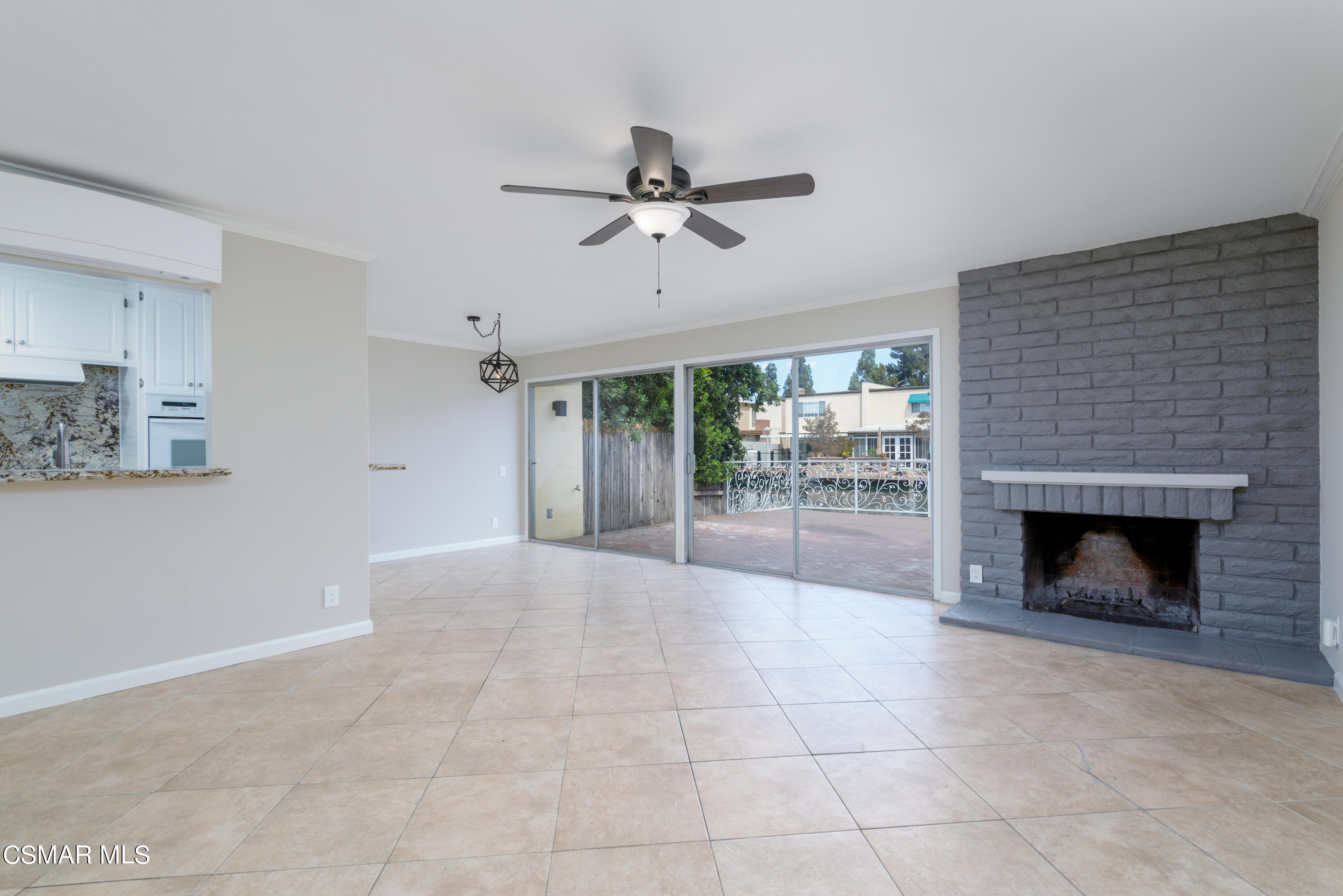 1667 Edgewater Lane Camarillo, CA 93010 - Photo 32 of 32 a view of an empty room with a fireplace and a window