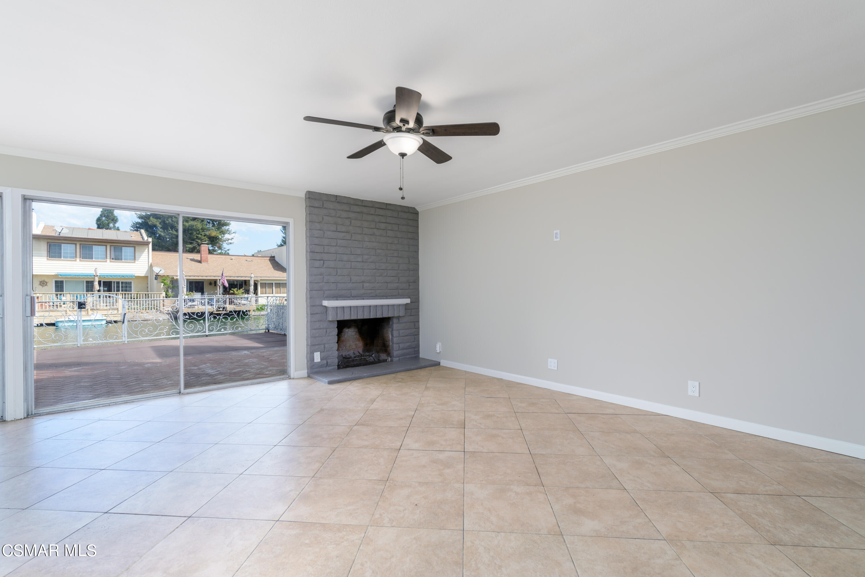 1667 Edgewater Lane Camarillo, CA 93010 - Photo 4 of 32 an empty room with fireplace and windows