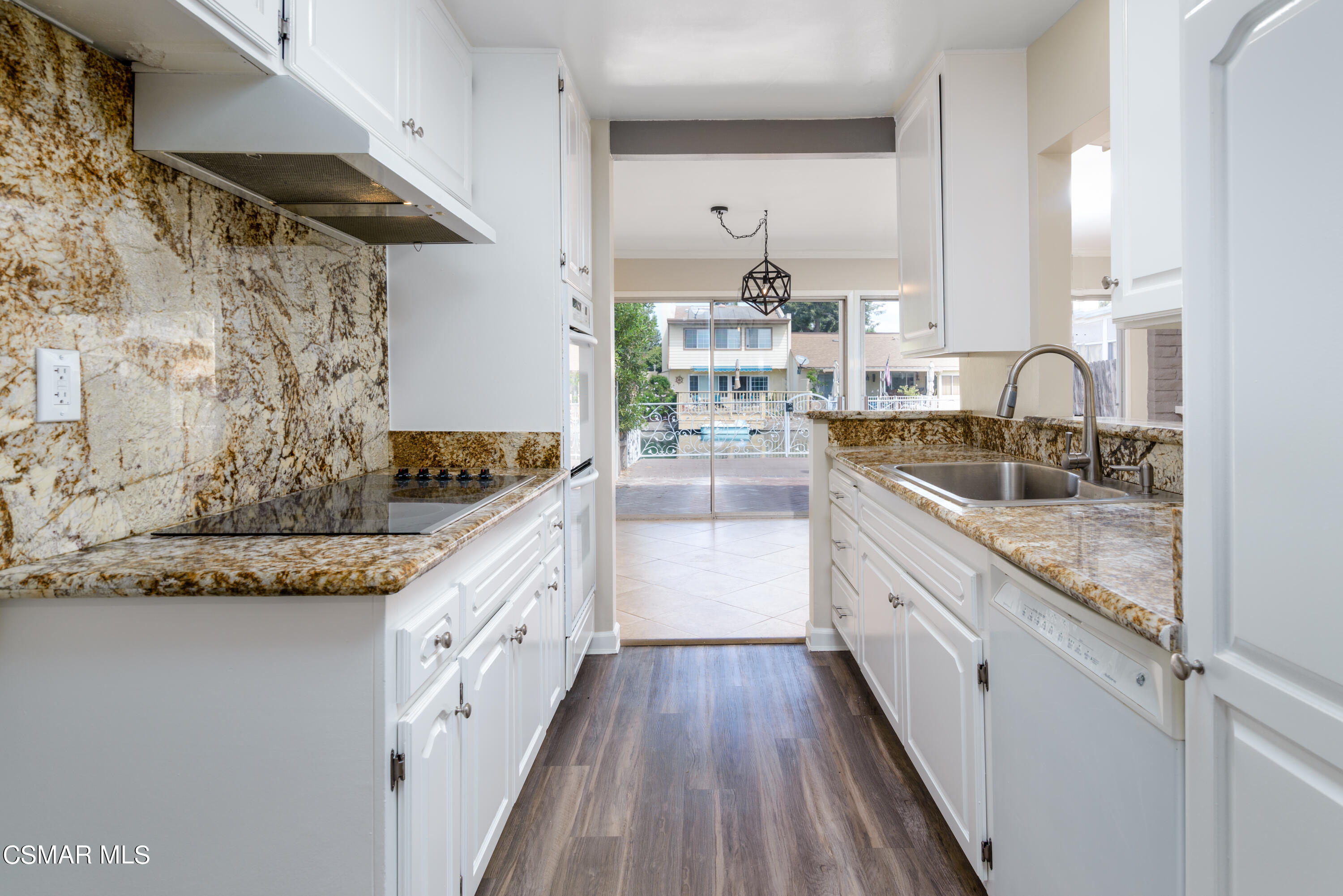 1667 Edgewater Lane Camarillo, CA 93010 - Photo 7 of 32 a kitchen with stainless steel appliances granite countertop a sink and stove