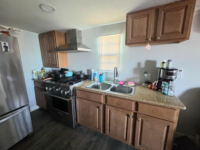 a kitchen with a stove and cabinets