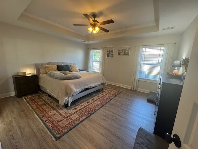 a bedroom with a bed and window
