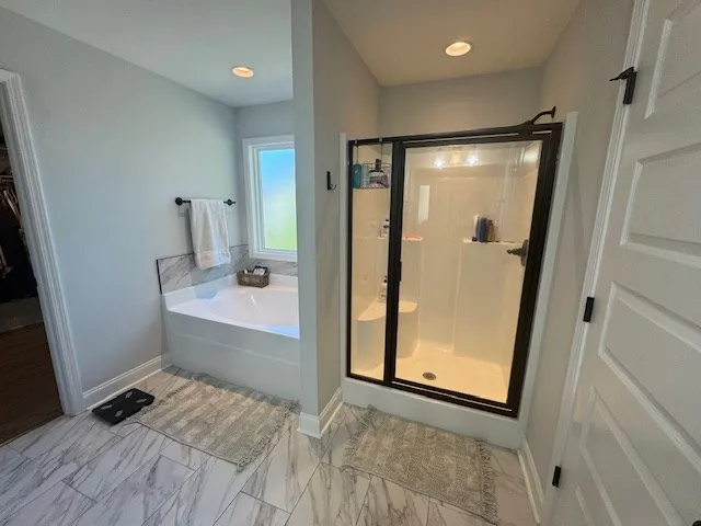 a bathroom with a tub and a sink