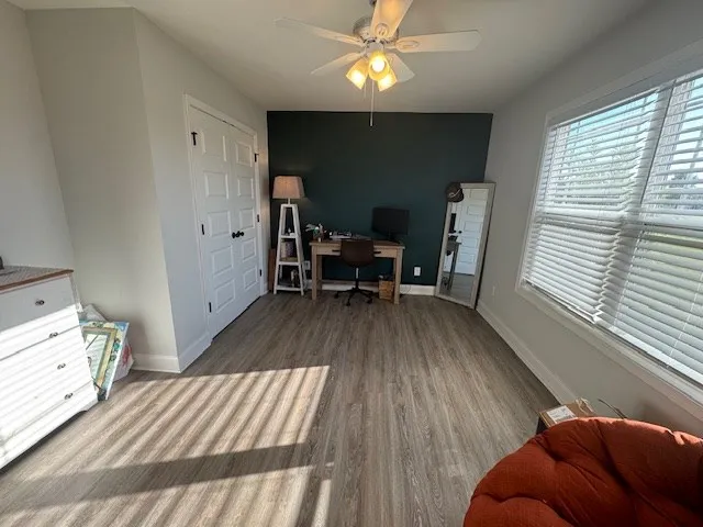 a view of a livingroom with furniture and wooden floor
