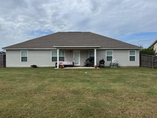 a front view of house with outdoor space